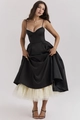 Detailed view of the corset bodice with lace trim and layered tulle underskirt of a black gown - S / Black