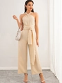 Elegant beige halter neck wide leg jumpsuit with waist tie and backless summer design - S / Apricot