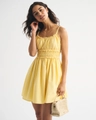 Close-up of yellow floral sundress with delicate smocking and ruffle detail on bodice - S / Yellow