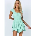 Slim-fit pale mint green romper with jacquard polka dots and ruffled hem details - Light Green