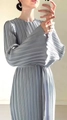 Detail of elegant pleated fabric on a light blue round neck dress with flared sleeves - S / Gray