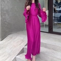 Detail of pleated dark pink maxi dress featuring layered ruffle cuffs and waist tie - S / Rose Red