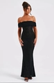 Detail of elegant black lace mermaid dress showing off-the-shoulder Bardot neckline texture - S / Black