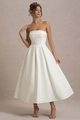 Detailed view of the smooth white satin fabric and high waist on this strapless dress - S / White