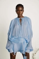 Detail of light blue pleated fabric showing the glossy texture and puff sleeve design - S / Blue