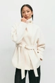 Detail of elegant cream wool coat with high stand collar and large button closure - S / White