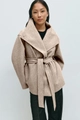 Detail of oatmeal wool coat featuring large lapels and adjustable waist belt tie - S / Camel