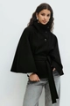 Detail of high neck black poncho coat with large decorative buttons and belted waistline - S / Black