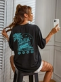 Oversized zwart katoenen T-shirt met blauwe vintage strandprint op de achterkant - S / Zwart