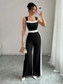 Combinaison sans manches chic noir et blanc avec col carré et détails de passepoils blancs - S / Noir