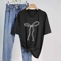 Women's black crewneck T-shirt featuring minimalist white bow print and knotted hem detail - S / Black
