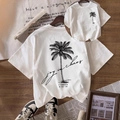 T-shirt coordinate famiglia in cotone bianco con stampa palma e scritta grafica - S / Bianco