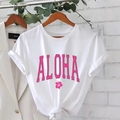 White short sleeve T-shirt featuring pink ALOHA print and stylish front hem knot detail - S / White