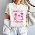 T-shirt da donna bianca in cotone con stampa grafica rosa West Coast Beach - S / Bianco