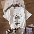 Wit katoenen T-shirt met vintage palmboomprint op een houten vloerbedekking - S / Wit