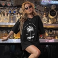 Black oversized Santa Barbara California graphic T-shirt with palm tree print design - S / Black