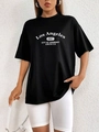 Détail de l'imprimé graphique Los Angeles 1997 sur un t-shirt noir ample en coton - S / Noir