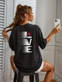 Detail of oversized black T-shirt featuring a white pixelated LOVE print and a red heart - S / Black