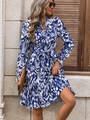 Detailed shot of elegant blue floral dress featuring bell sleeves and a waist belt tie - S / Blue