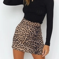 Short leopard print A-line mini skirt paired with a slim fit black long sleeve top - S / Leopard 2