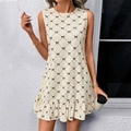 Sleeveless A-line mini dress with black bow grid pattern and ruffled hem in cream white - S / Apricot