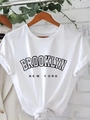 White cotton t-shirt featuring Brooklyn print and a stylish knotted hem design - S / White