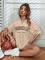 Oversized apricot Brooklyn t-shirt styled with a creative basketball handbag - Khaki