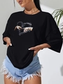 Detail of artistic hand gesture print and Have a Holiday text on black cotton T-shirt - S / Black