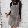 Detail view of plaid pinafore dress with front ring zipper and plaid pattern texture - XL / Coffee