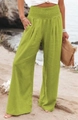 Detail van de groene gesmokte taille en zijzakken op de wijde broek met hoge taille - S / Fluorescerend Groen