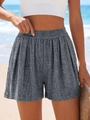 Détail de la taille haute élastique sur un short gris ample à texture fine - S / Gris Chiné