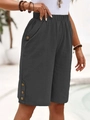 Detail of dark grey linen shorts with elastic waist and decorative buttons on the leg - S / Dark Gray