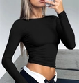 Close-up detail of a slim fit black long sleeve crop top with elastic knit fabric material - XS / Black