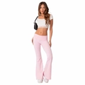 Pink low-rise flared yoga pants with white lace crop top on a female model - XS / Pink