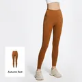 High-waisted yoga pants in Autumn Red with side pockets and seamless fit - S / Bottoms / Autumn Red