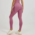 Women high-waisted yoga leggings in dusty pink with side pockets and lifting effect - S / Bottoms / Dusty Pink