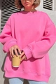 Close-up of oversize hot pink sweatshirt with crewneck and ribbed cuffs for autumn style - S / Pink