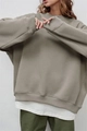 Detailed close-up of ribbed cuffs and layered oversized crewneck sweatshirt in olive green - S / Light Gray