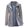 Detail view of grey hooded raincoat with striped lining and adjustable drawstring waist - Gray