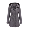 Detail of dark grey hooded parka featuring adjustable waist drawstrings and secure zip closure - S / Tops / Gray