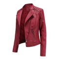 Detail of dark red faux leather biker jacket featuring zippered pockets and stitched textures - Burgundy