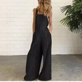 Detail of black cotton linen jumpsuit featuring wide-leg cut and side button accents - S / Black