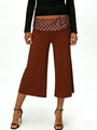 Detail view of brown wide-leg cropped pants with retro polka dot waistband accents - S / Brown Polka Dot