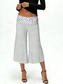 Detail view of women's grey wide-leg pants with a polka dot elastic waistband design - S / Grey Polka Dot