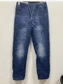 Détail du pantalon en jean bleu déchiré avec taille élastique à cordon et effet délavé - S / Bleu foncé