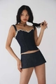 Detailed view of dark blue denim corset top with raw edge and matching mini skirt - S / Camisole Top And Mini Skirt (FV11676)