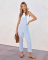 Detail van lichtblauwe zomerse jumpsuit met voorzakken en dunne schouderbandjes - S / Lichtblauw