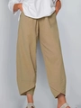 Détail du pantalon kaki montrant la texture coton-lin et l'ourlet tulipe croisé - S / Kaki