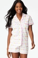 Detail of summer pajama set featuring colorful star and heart prints with pink piping trim - S / White Star Print