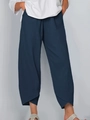 Detail of navy blue cropped wide leg pants featuring unique tulip overlapping split hems - Navy Blue